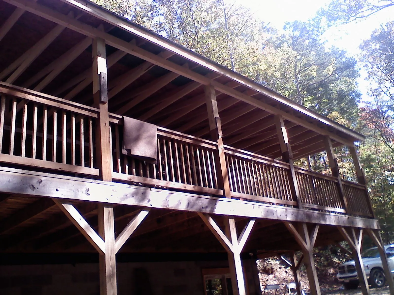 Timber framing under a new elevated porch and deck — Roof Leak Repair in Hartfield by Roofing Brothers